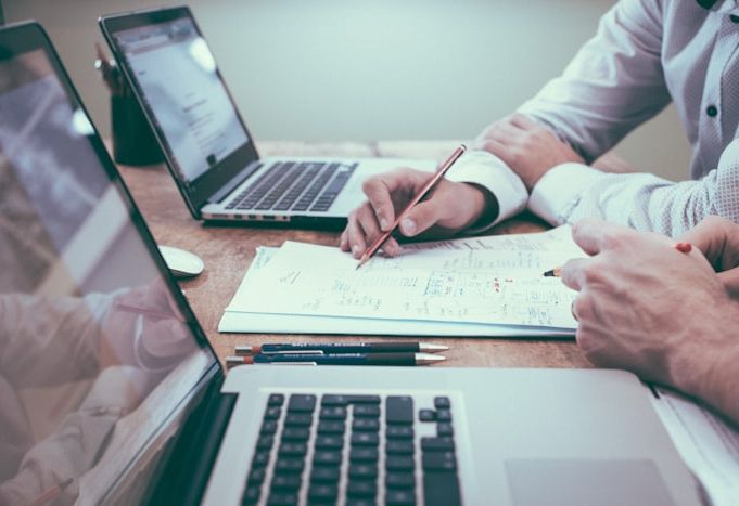 Agent and client reviewing insurance documents together
